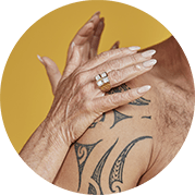 woman applying cream on mans tattoo